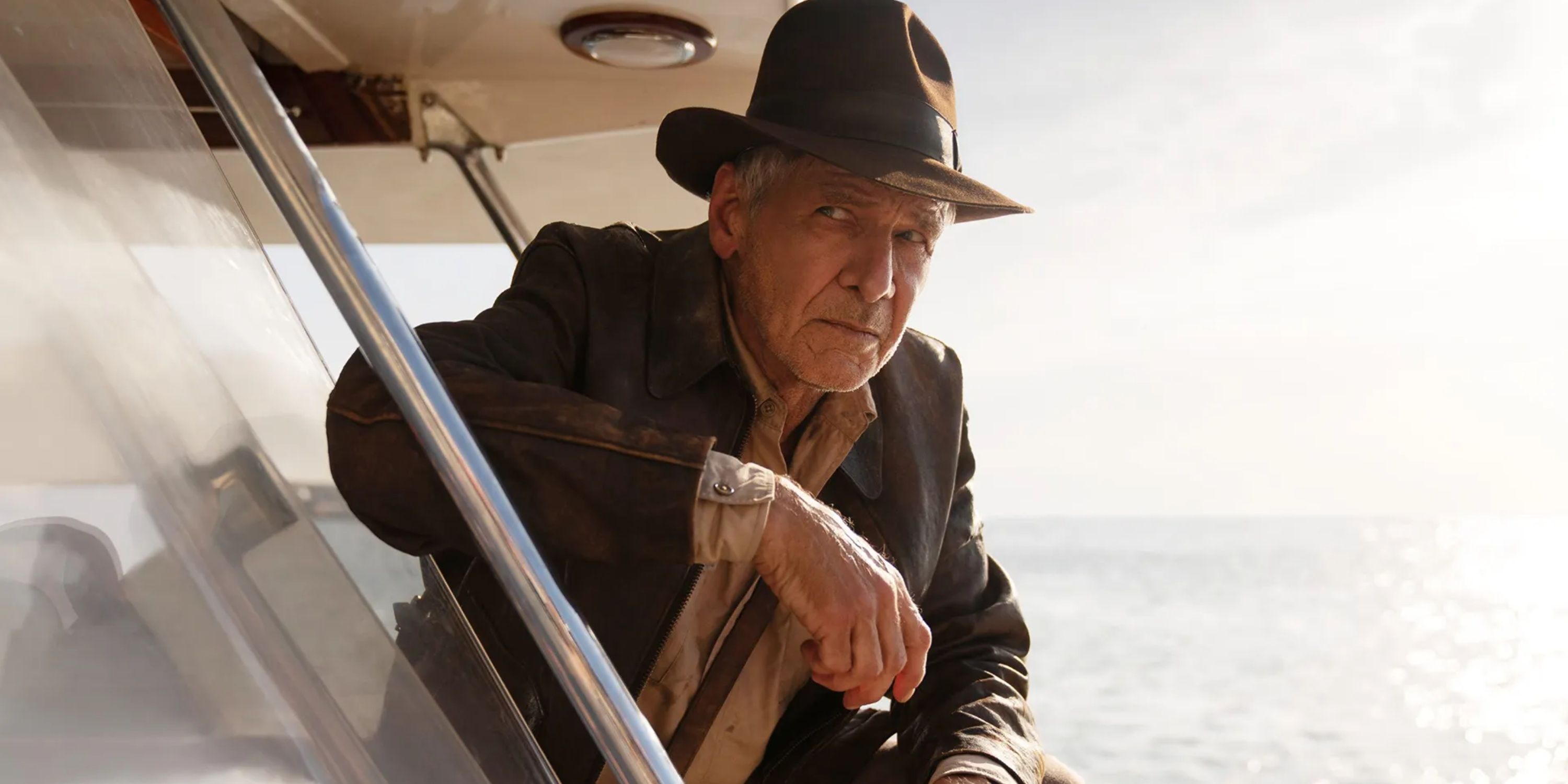 harrison ford as indiana jones on a boat in dial of destiny