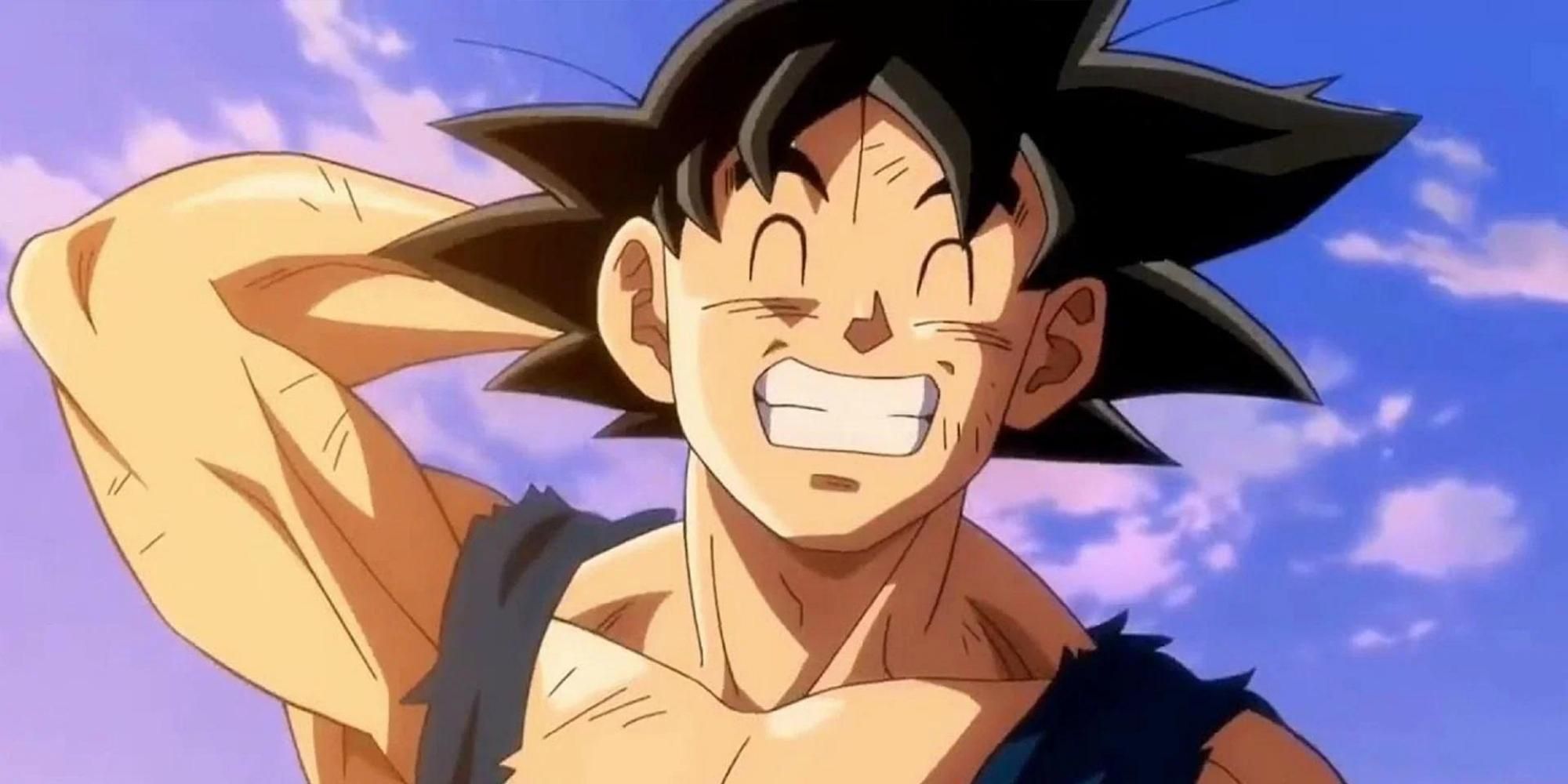 Goku covered in scratches and smiling after a battle