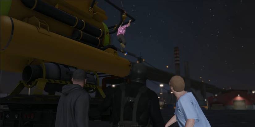 Franklin, Michael, and Lester looking up a Trevor, who is hanging from a submarine in GTA 5