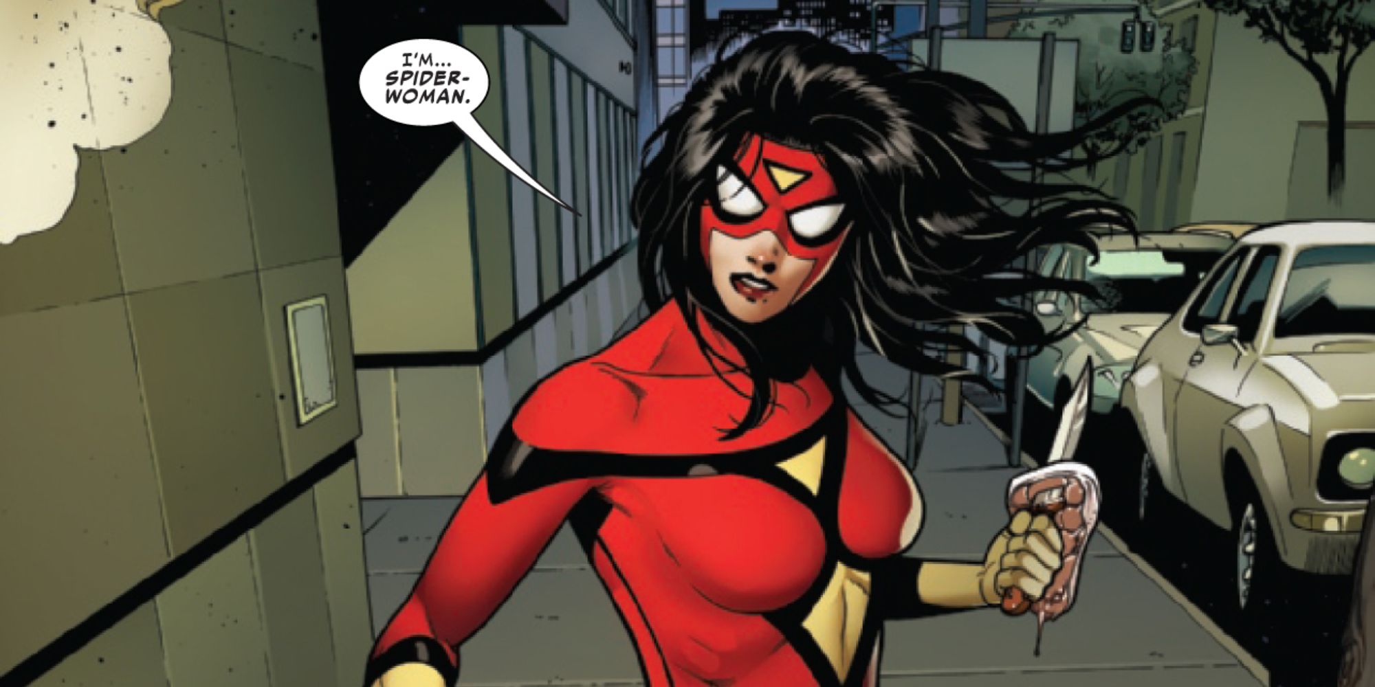 Jessica Drew holding a knife on the street
