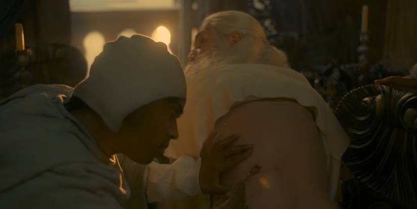 Viserys undergoes treatment from his maester in House of the Dragon.