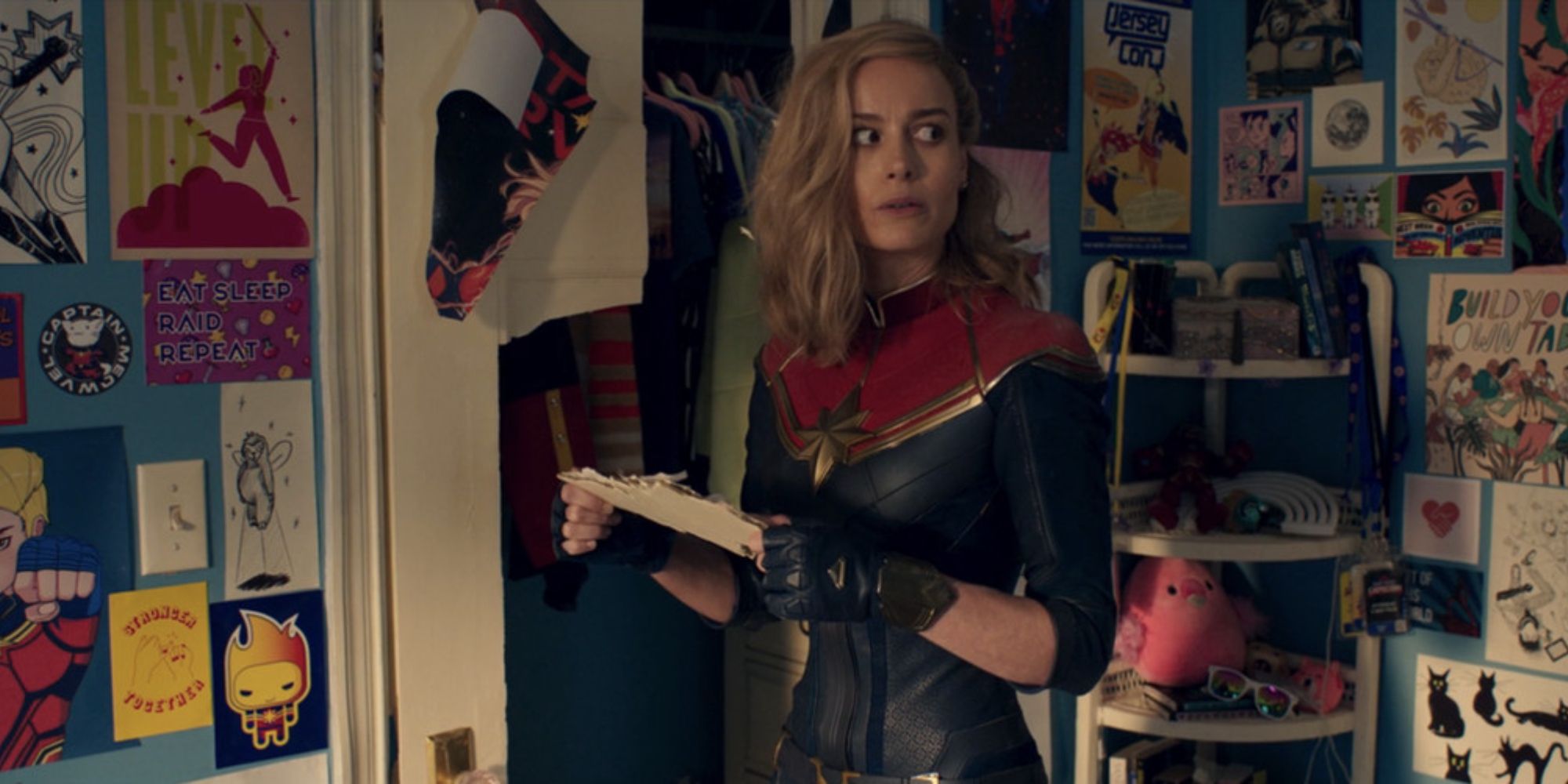 Carol standing in Kamala's bedroom