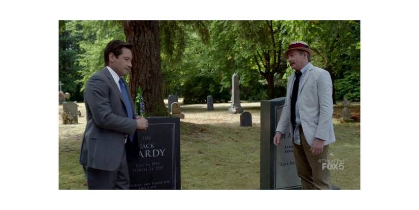 Mulder (left) speaking to Guy Mann (right) in a cemetary. Image source: X-Files.fandom.com