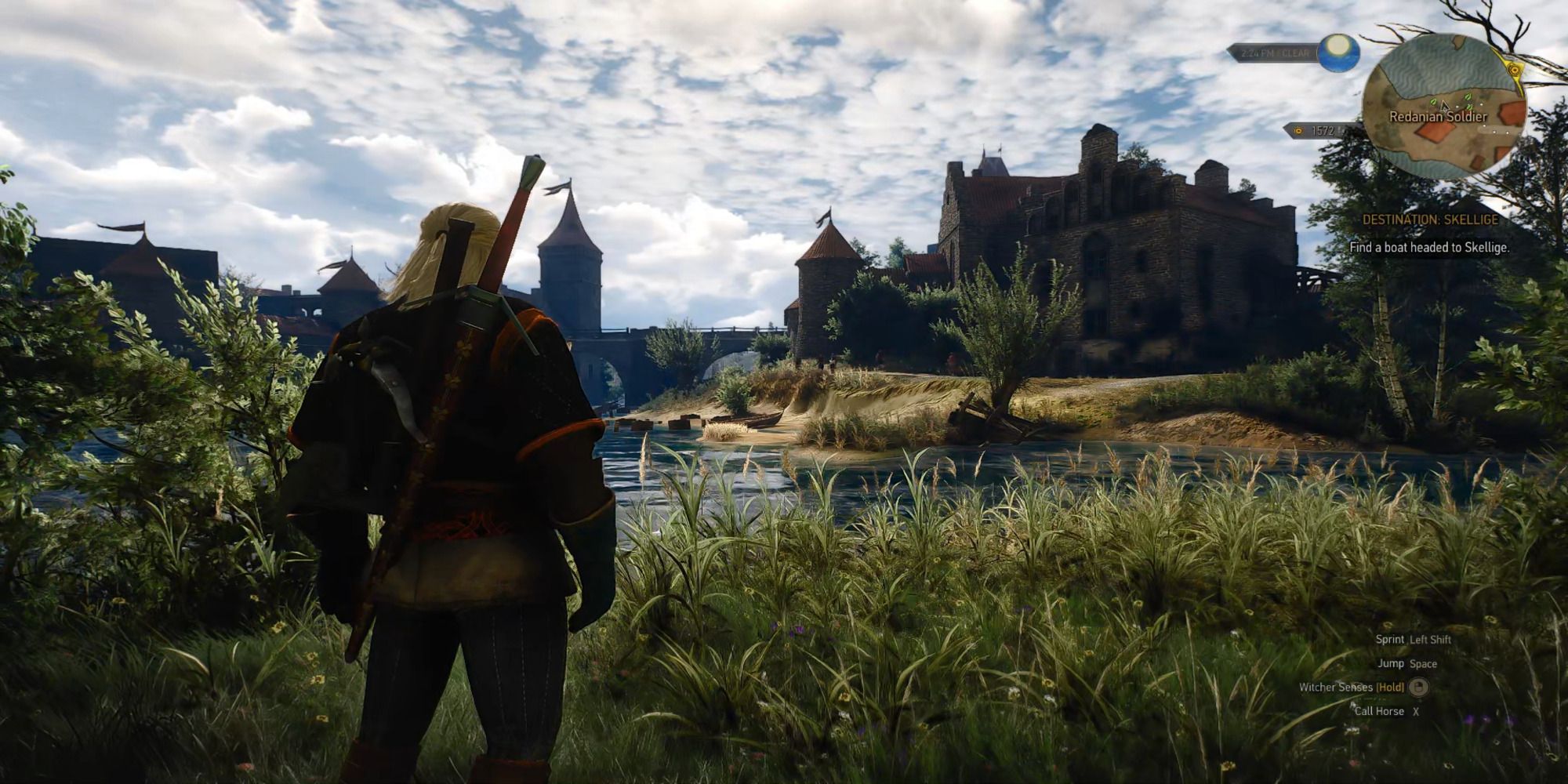 Geralt looking out at a large keep.