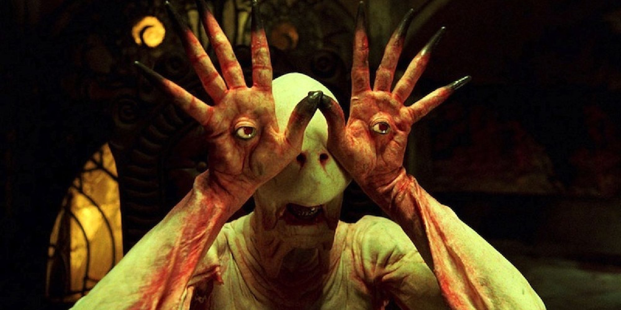 The Pale Man holding his hands up to his face, his eyes in the palm of his hand