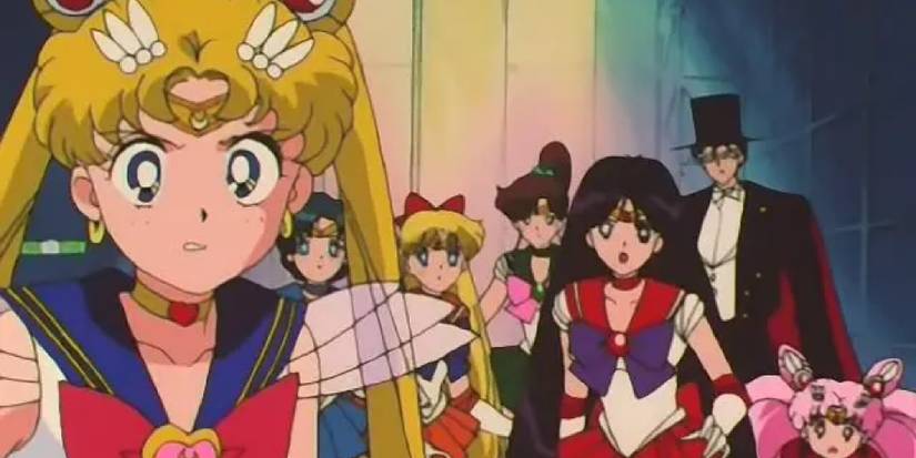 The Sailors, Tuxedo Mask and Chibiusa stand together with looks of dismay or frustration towards the camera