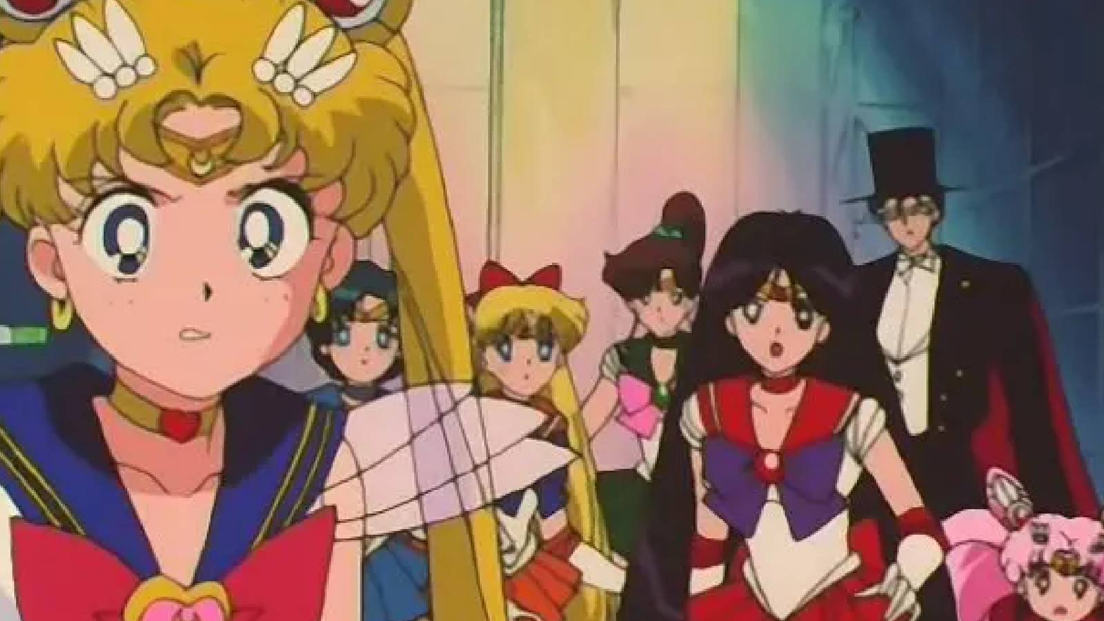 The Sailors, Tuxedo Mask and Chibiusa stand together with looks of dismay or frustration towards the camera