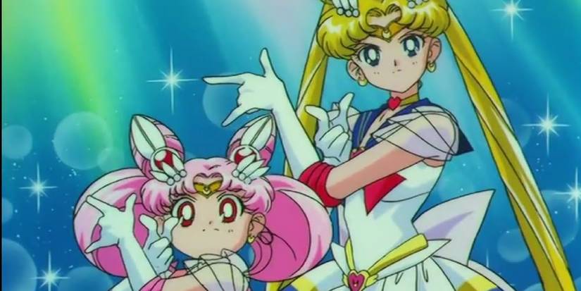 Sailor Moon and Sailor Chibi standing side by side in action-ready poses.