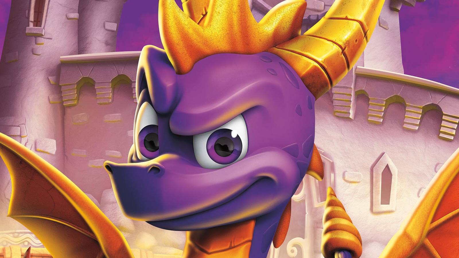 A close-up of Spyro the Dragon's face as he stands in front of a castle under a purple night sky.