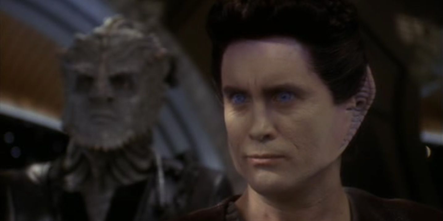 Weyoun, a pale alien with intense blue eyes; behind him is a blue-grey scaled alien.