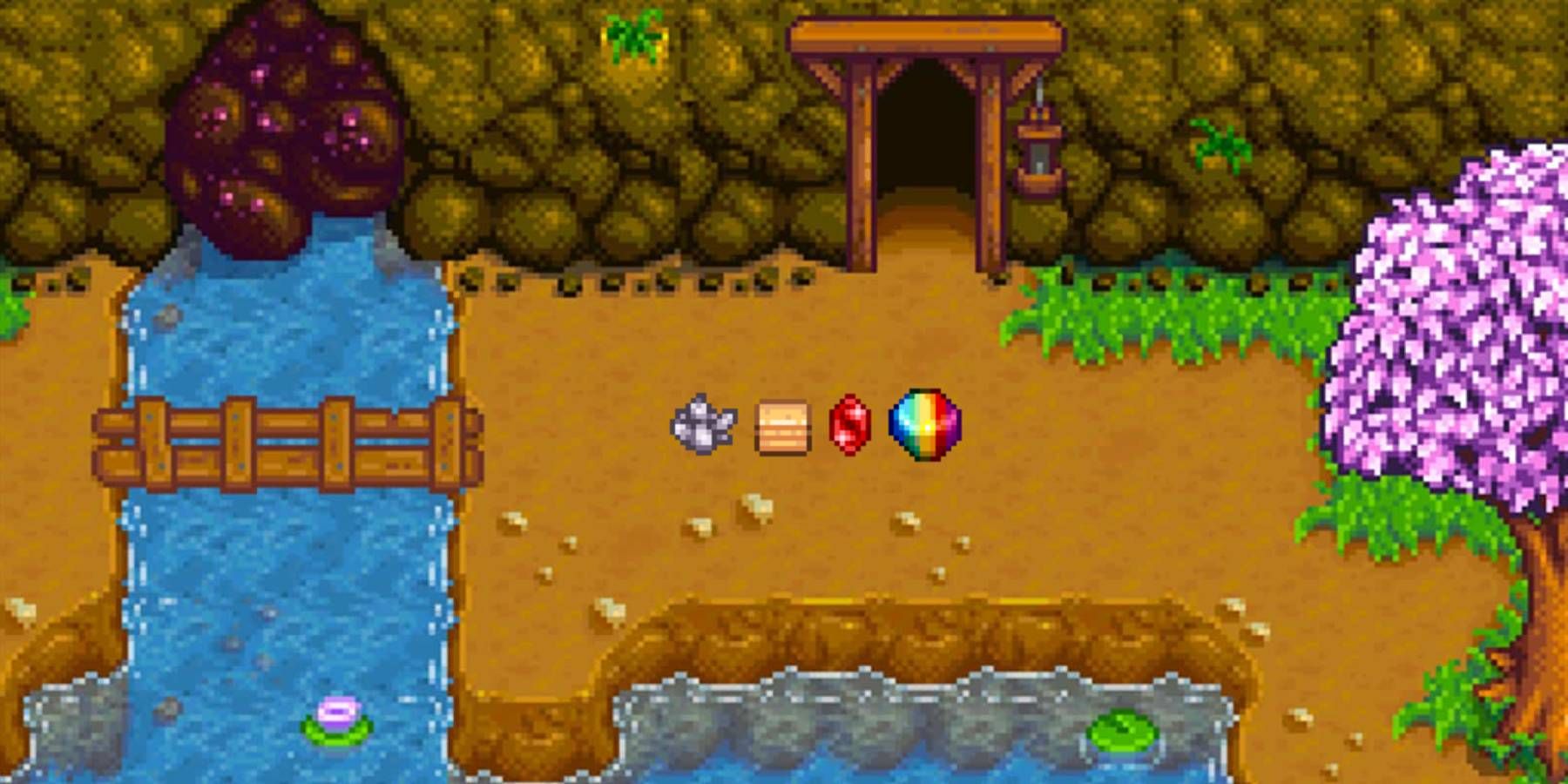 Quartz, Sandstone, Ruby, and a Prismatic Shard in front of the mine in Stardew Valley