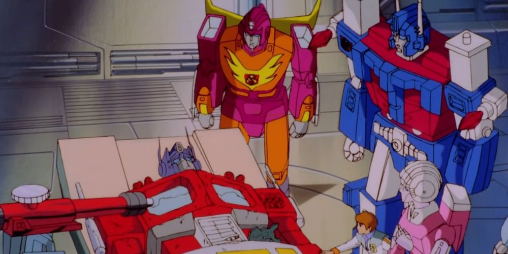 Optimus, battle-damaged, lying on a medical table, surrounded by his allies.
