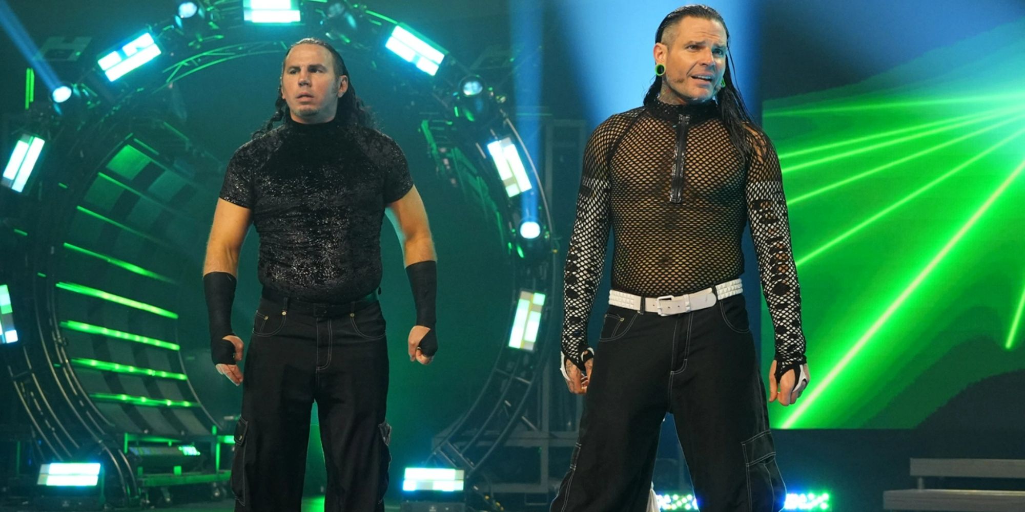 Former WWE and current AEW stars Matt and Jeff Hardy standing side by side on the entrance ramp of an AEW event.