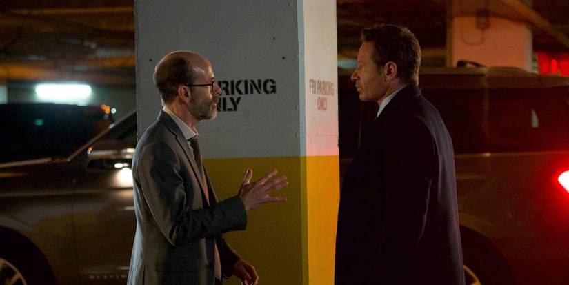 Reggie (Brian Huskey) and Fox Mulder (David Duchovny) in a parking garage. Image source: X-Files.fandom.com