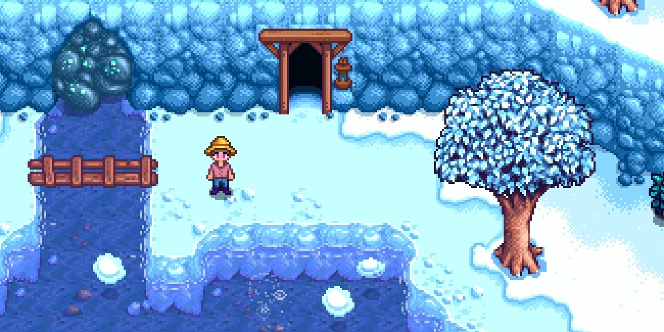 A farmer standing in front of a fishing spot near the mines in Winter