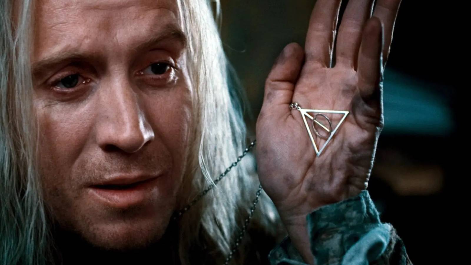 Xenophilius Lovegood with the Deathly Hallows sign