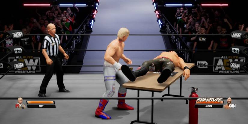 AEW Fight Forever Cody placing Lance on the table