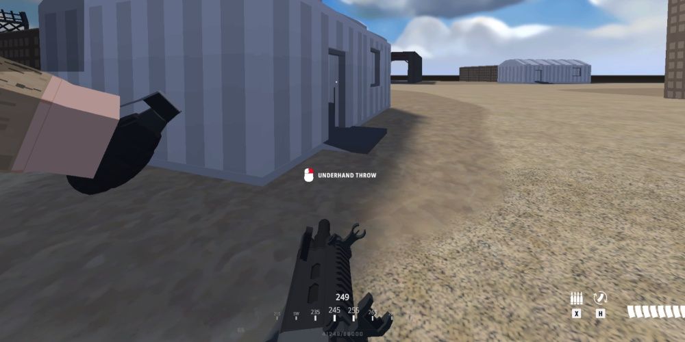 BattleBit Remastered player holding AUG assault rifle peeks a small house with a frag grenade. He is angling his target reticle to throw the grenade into the house's doorframe.