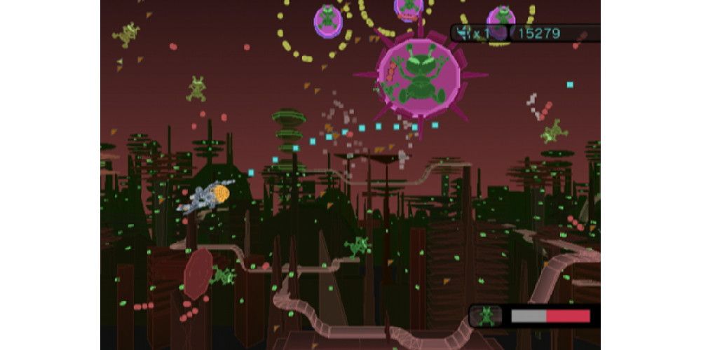 A small ship firing at flying aliens in a futuristic city. Image source: IGDB.com