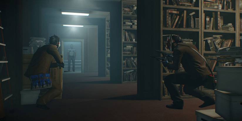 two payday 2 players watching a guard