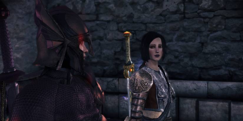 Cousland Warden is escorted by Warden Recruit Mhairi at Vigil's Keep in Dragon Age: Origins - Awakening