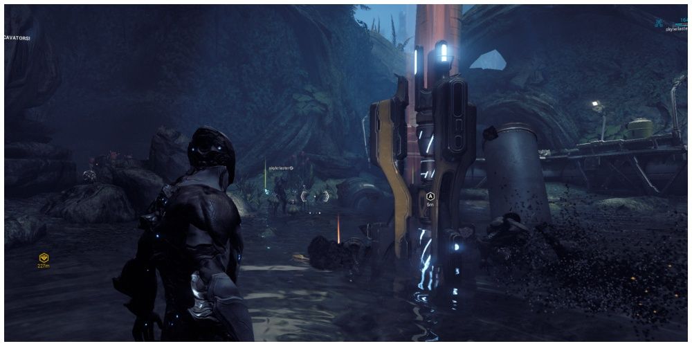 Excalibur Warframe stands before an excavator, digging for the Cryotic resource