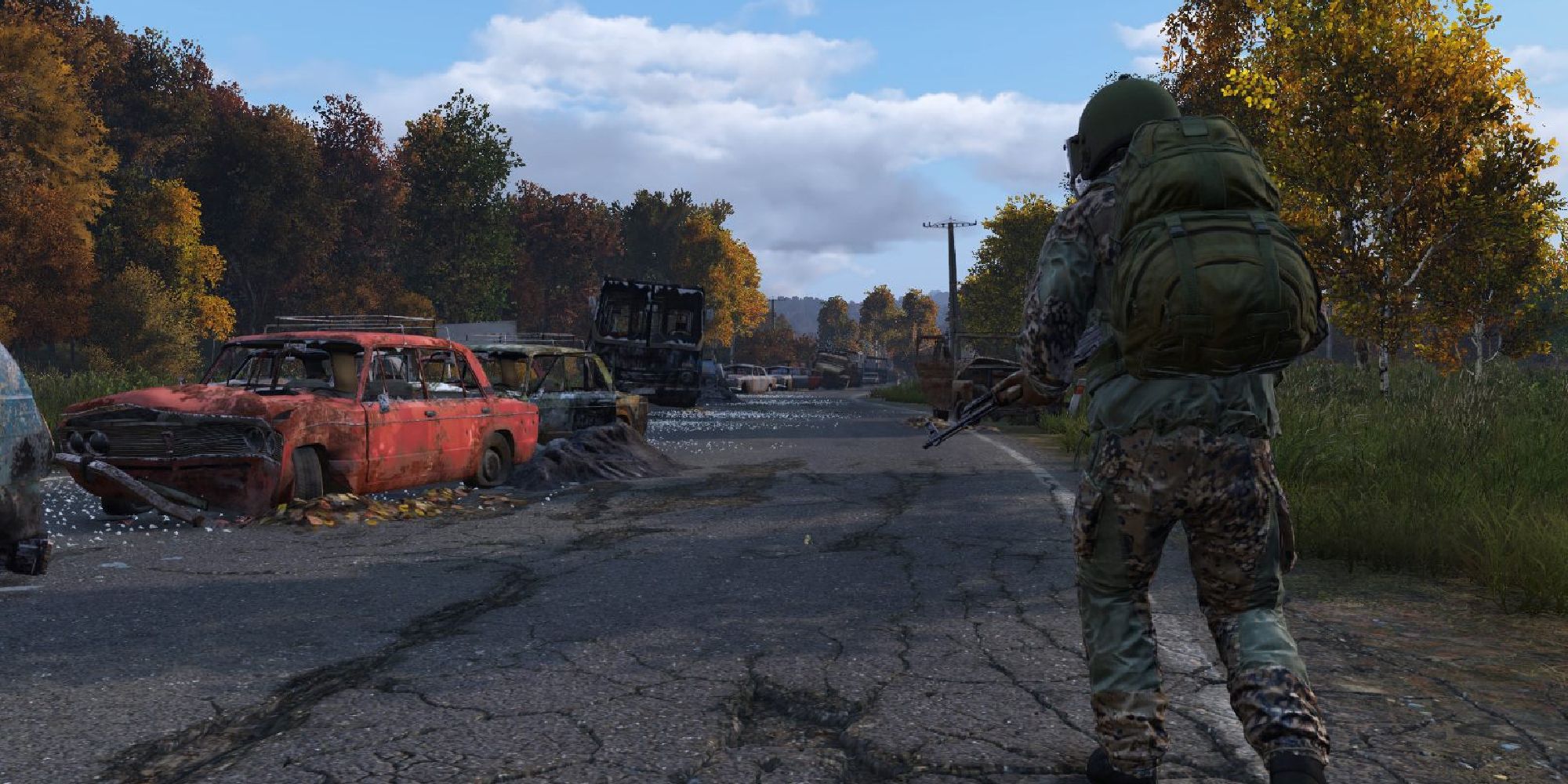 A player runs through the desolate streets filled with abandoned cars, a combat backpack 