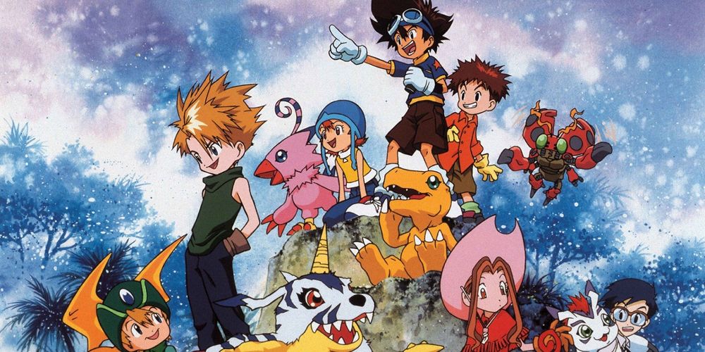 group picture, humans and digimon sat on a rock