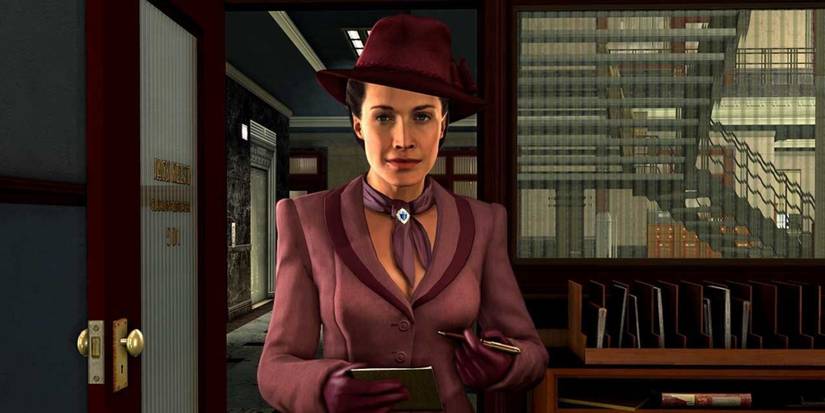 elsa lichtmann in purple suit and hat