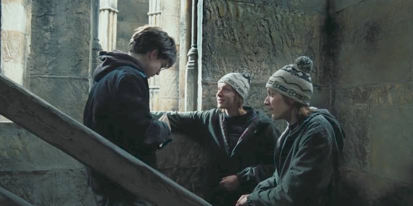 Fred and George Weasley giving Harry Potter the Marauder's Map