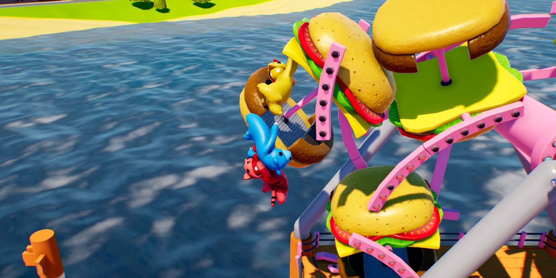 Three characters hanging off a burger car on a ferris wheel in Gang Beasts
