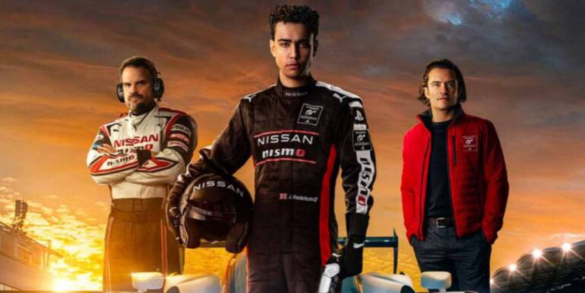 Jack Salter in nissan jacket, Jann holding a helmet in full racing gear and Danny in a red jacket