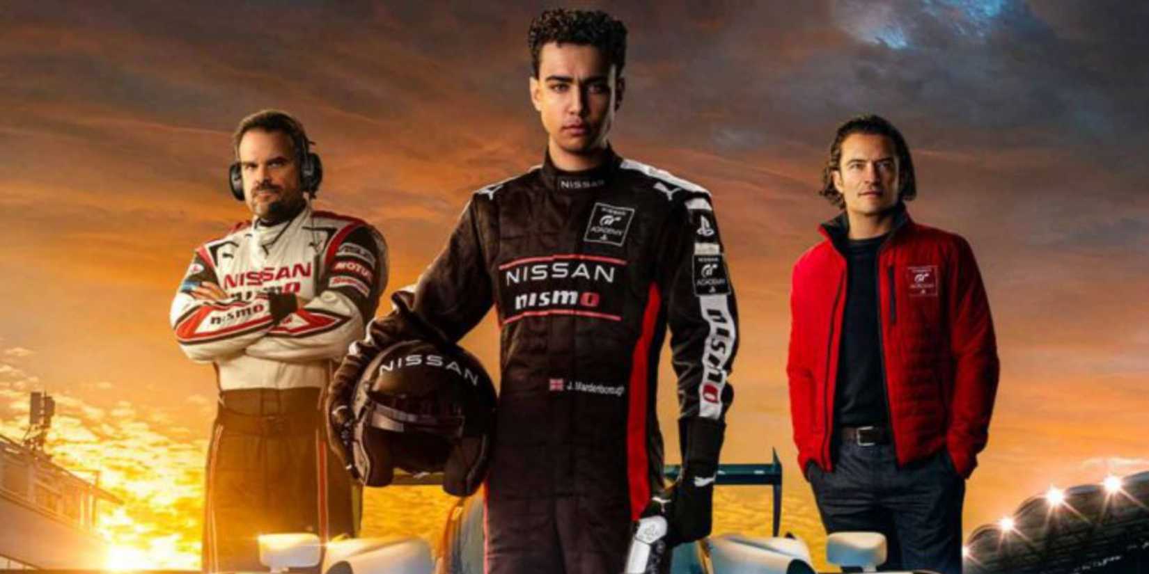 Jack Salter in nissan jacket, Jann holding a helmet in full racing gear and Danny in a red jacket