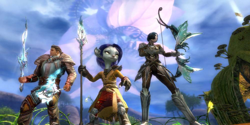 Three Guild Wars 2 characters holding weapons