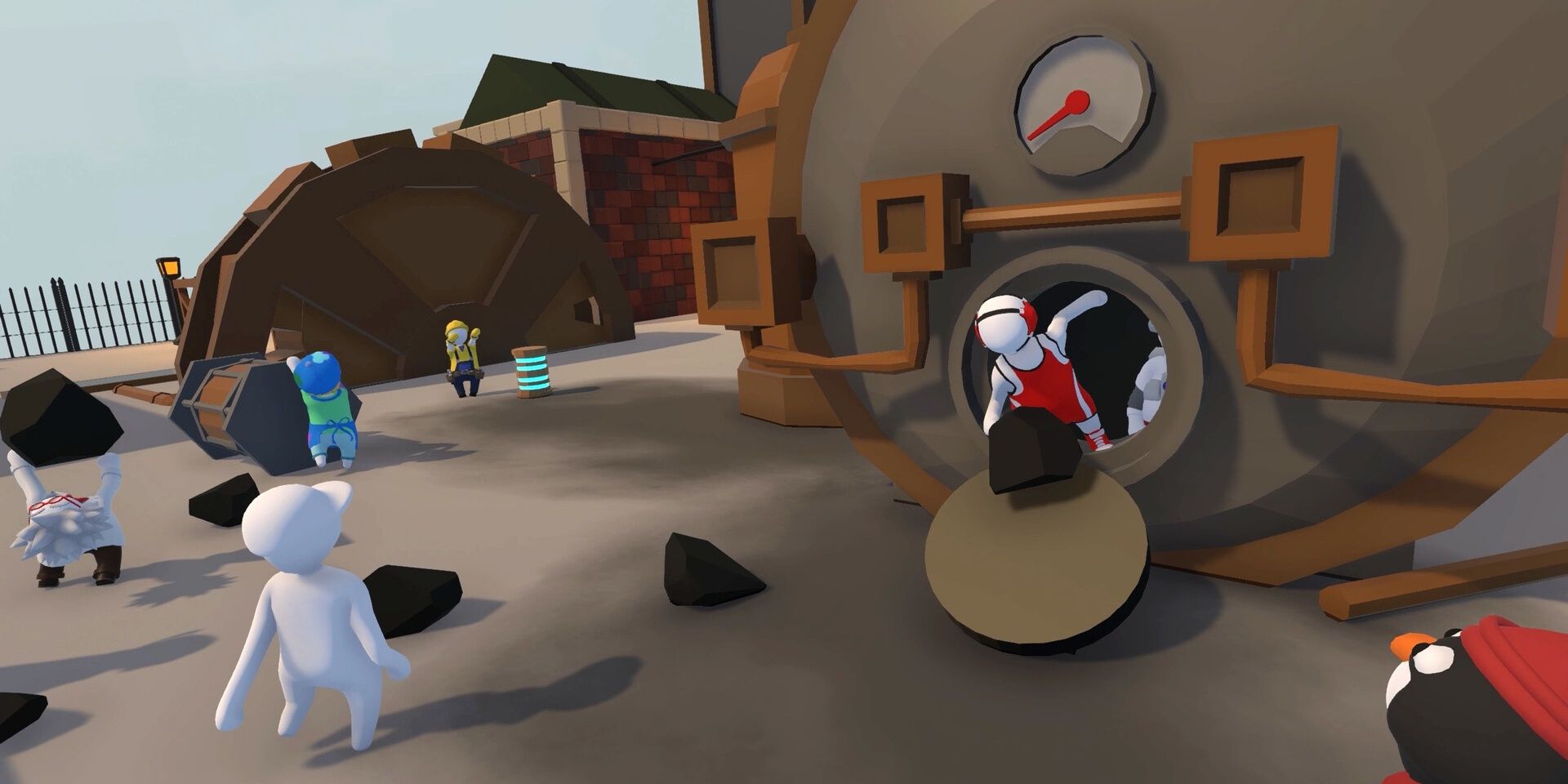 A handful of Human Fall Flat navigating a facility, with some taking coal out of ovens