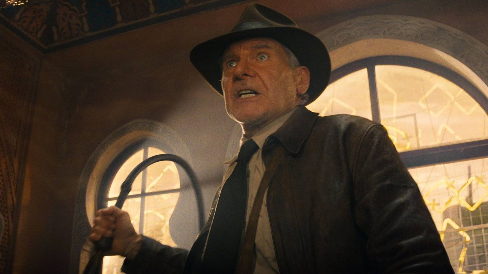 Indy with a whip in Indiana Jones and the Dial of Destiny