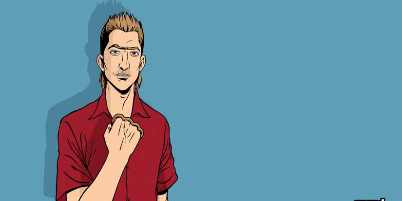 kent paul in a red shirt in front of a blue background