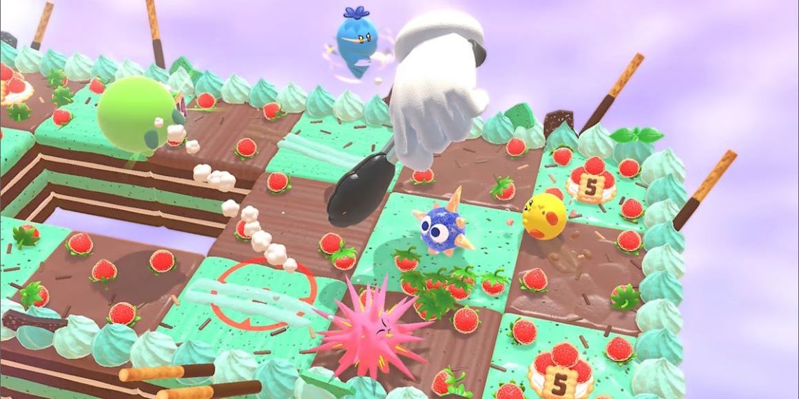 A green Kirby is launched by a spiky pink Kirby while blue Kirby is a carrot spinning down to above a hand that is holding a pan on a Chocolate Mint Cake arena in Kirby's Dream Buffet