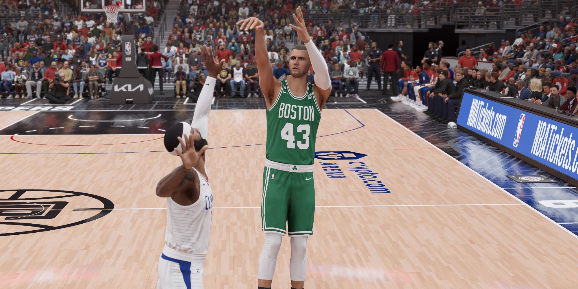 Kristaps Porzingis wearing Boston Celtics colors as he attempts a 3-point shot