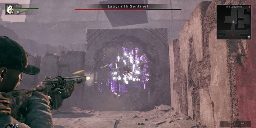 A player engaged in a fight with the Labyrinth Sentinel from Remnant 2