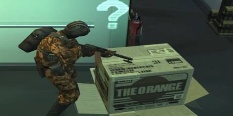 Solid Snake hiding inside a Cardboard Box