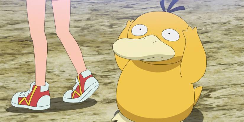 Misty standing next to her Psyduck
