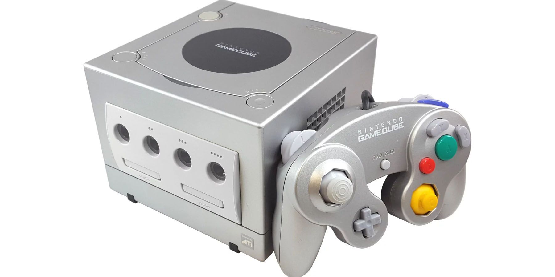 An image of a silver Nintendo GameCube and a controller against a white background.