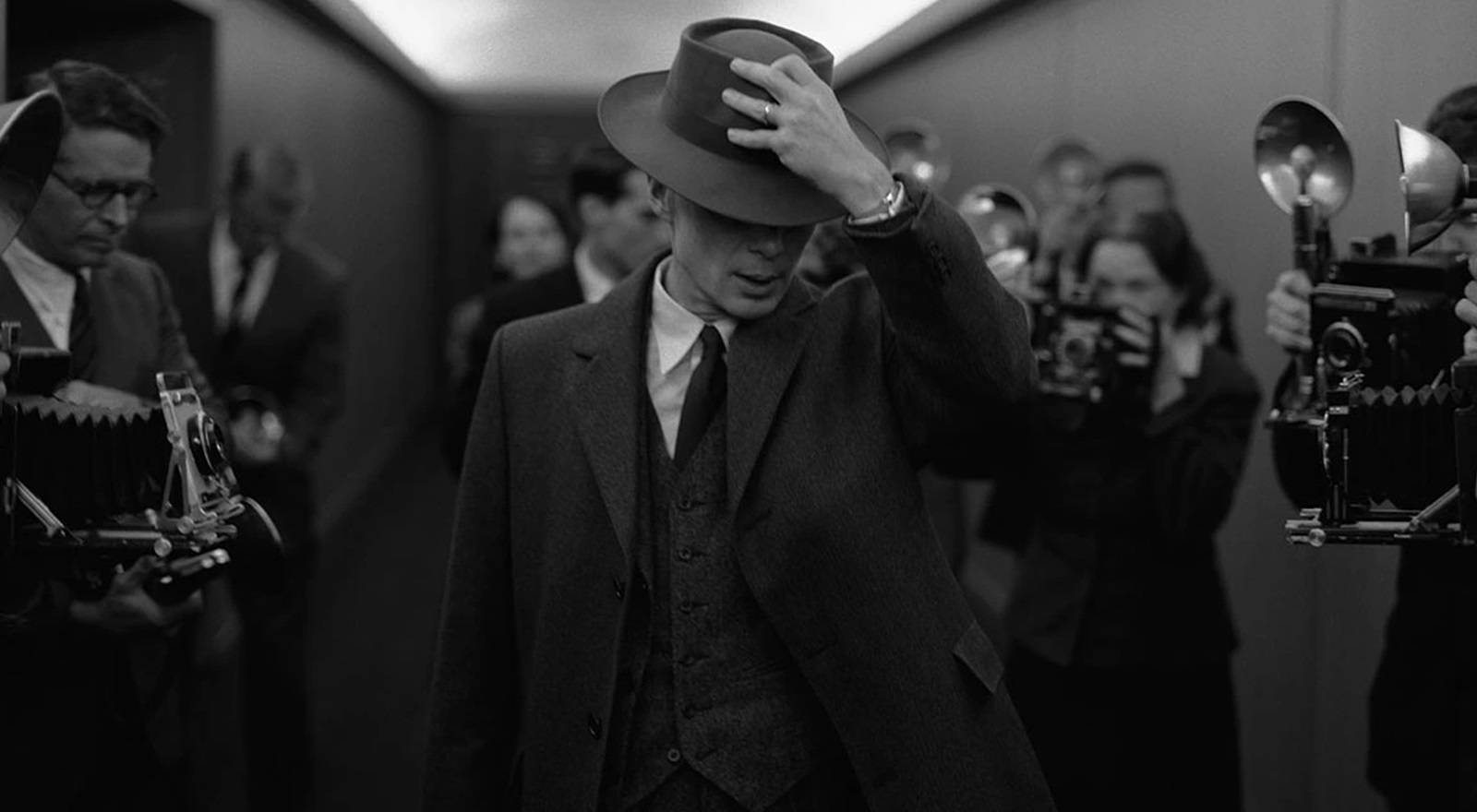 Oppenheimer is photographed in a hallway in Oppenheimer