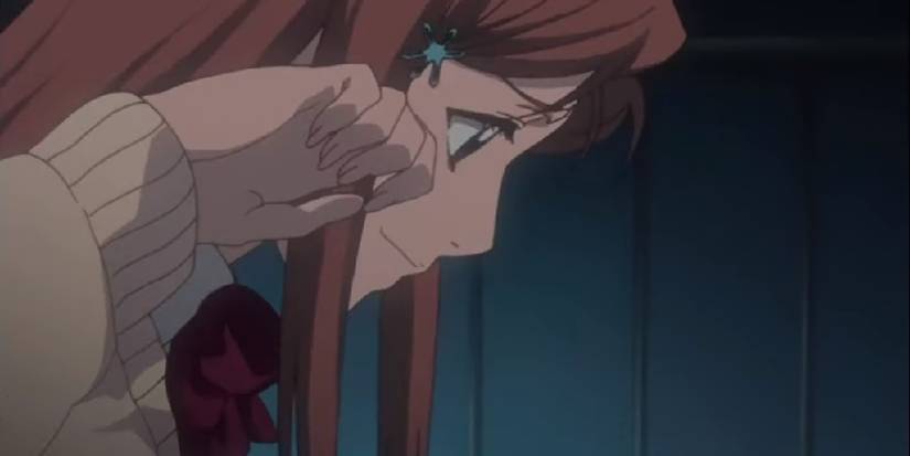 Orihime wiping away her tears as she bids farewell to Ichigo in the Bleach anime