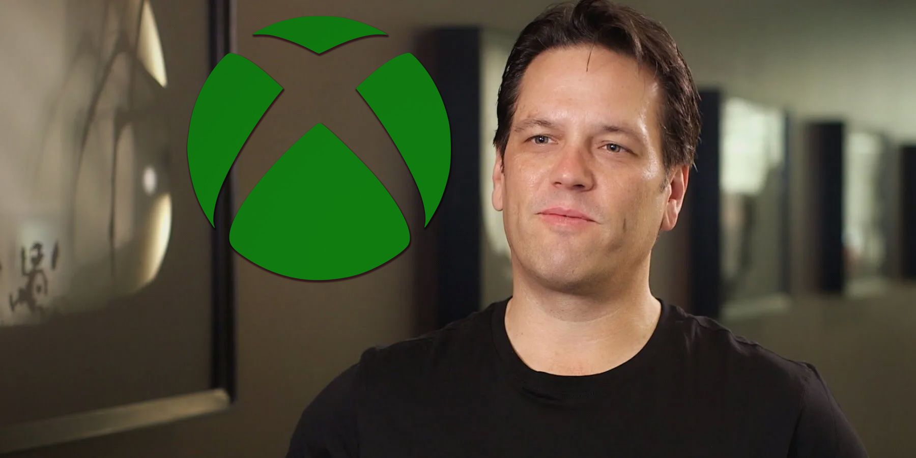 Phil Spencer next to 3D Xbox emblem logo composite