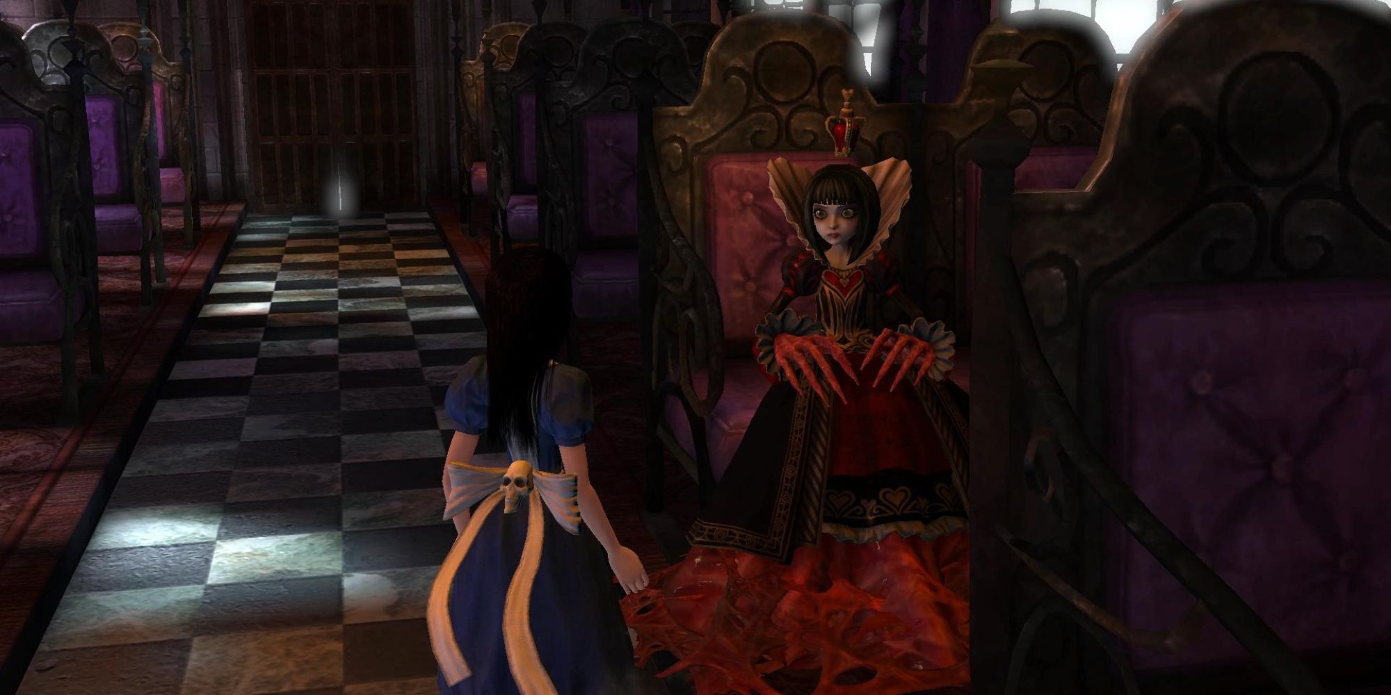 Queen of Hearts sitting in a chair in the game Alice