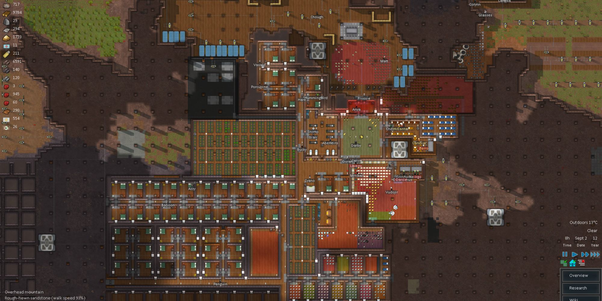 A screenshot from Rimworld, showcasing a settlement and gameplay.