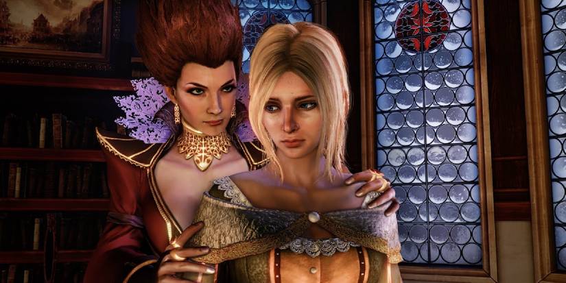 Two women from the game a blonde woman stood at front with, a red haired woman behind her, hands on her arms. 