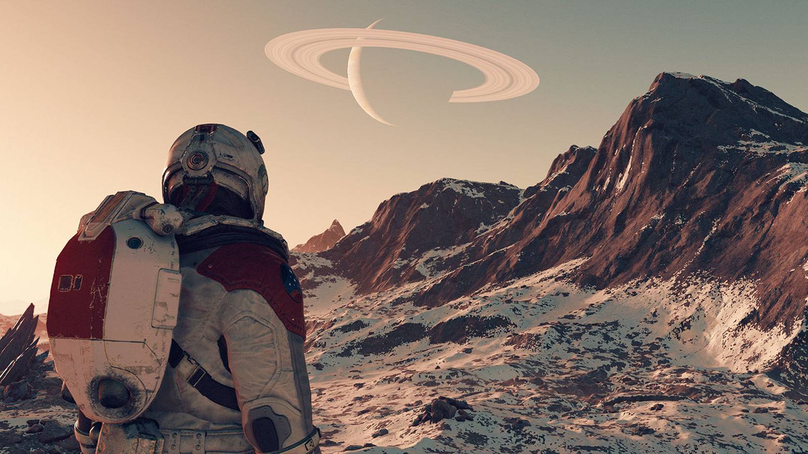 A screenshot of the player character exploring a group of snow-covered cliffs in Starfield.